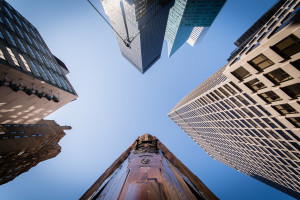 Looking up between skyscrapers in downtown Manhattan
